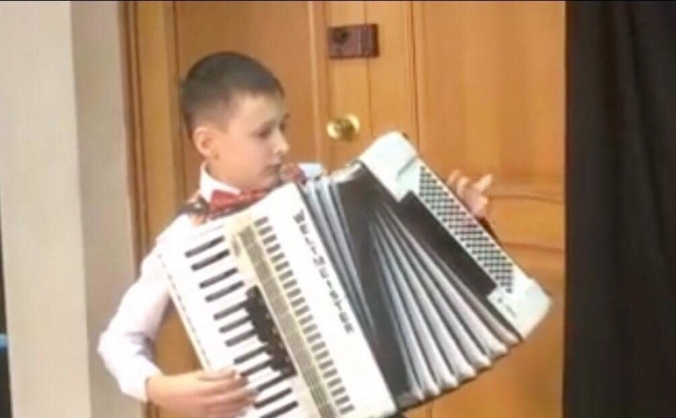 to buy a blind Russian boy , his own accordion