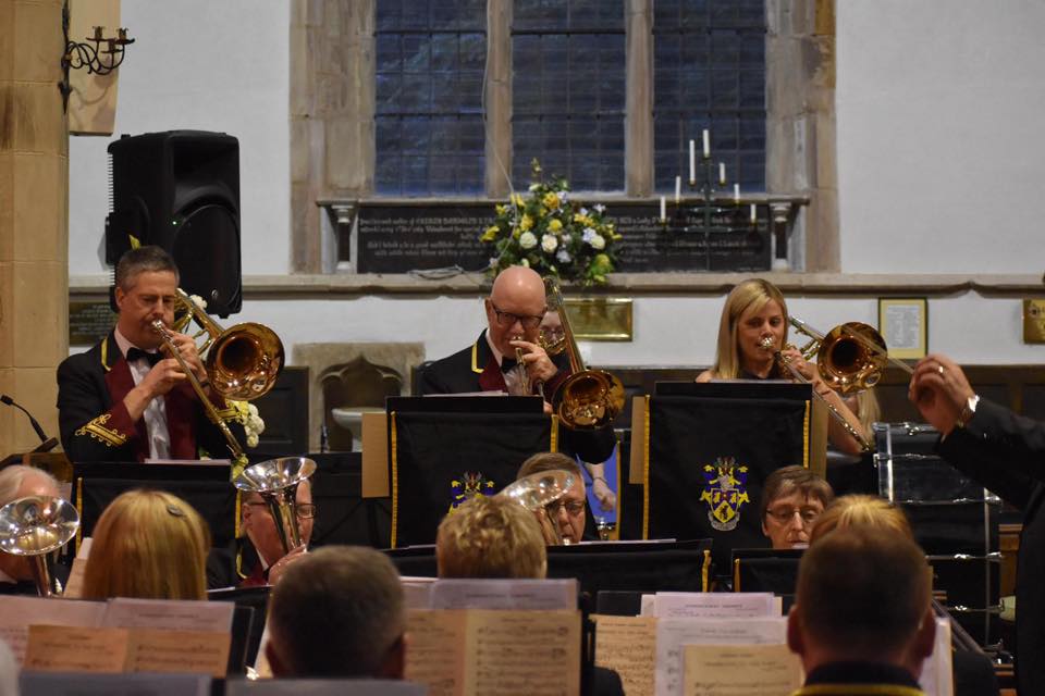 trombonists playing trio