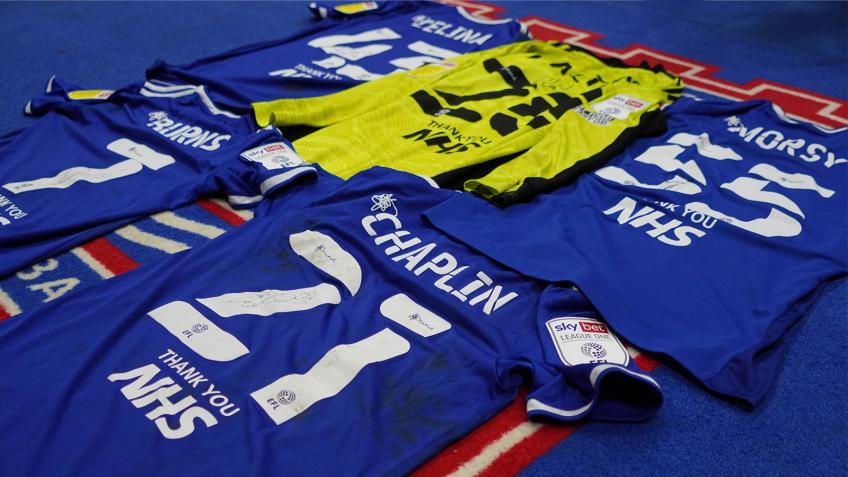 WIN one of 5 signed match worn ITFC shirts