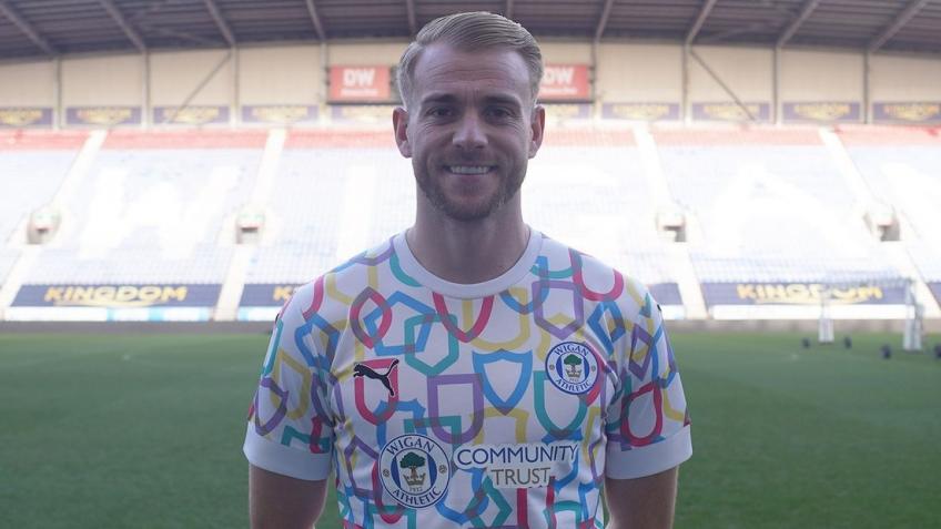 Win a signed Latics x Puma Together warmup shirt