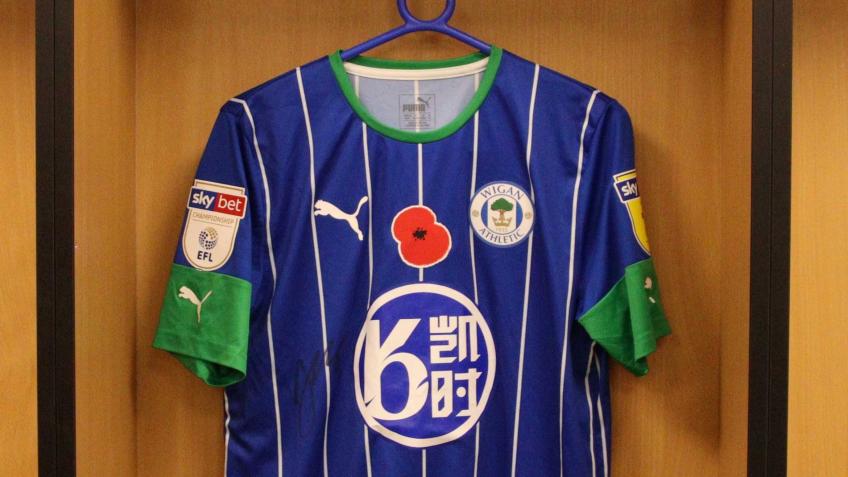 Win a signed match worn Jamal Lowe Poppy Shirt