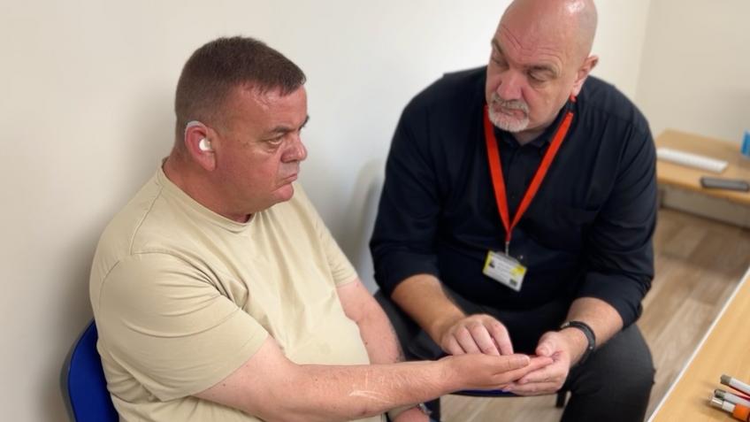 An access friendly computer for a deafblind man