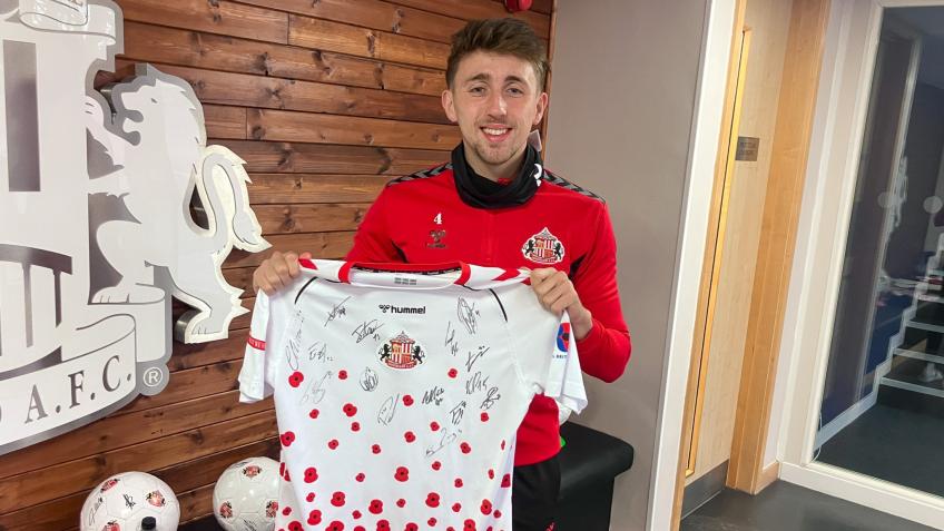 Squad signed Remembrance Day shirt
