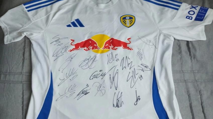 Action For Sport - Signed Leeds United Shirt